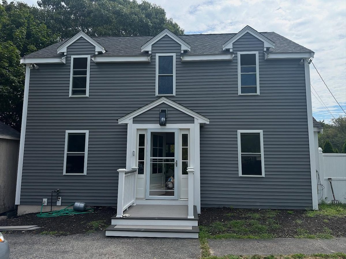 Front of the house after its Nessara Construction re-side, with new siding and trim